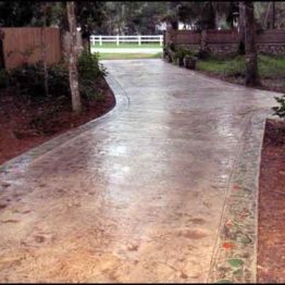 Seamless-Textured-Stained-Concrete-Driveway-With-Decorative-Border